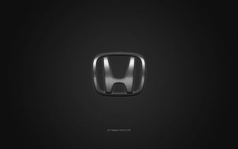 Значок Хонда на черном фоне