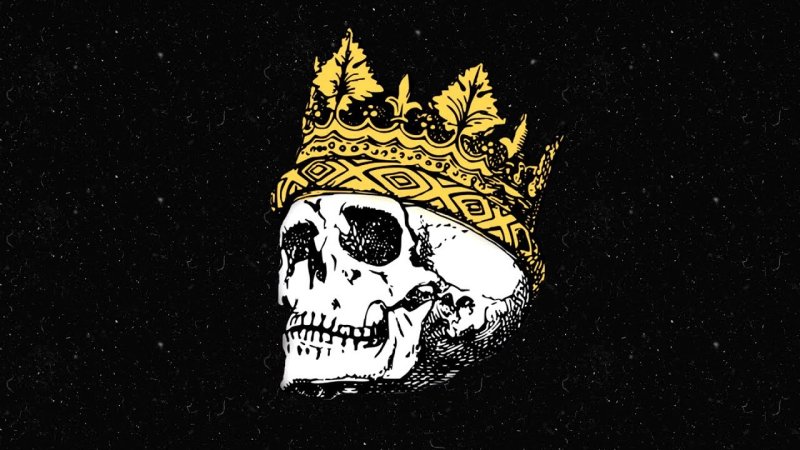 Череп с короной на черном фоне
