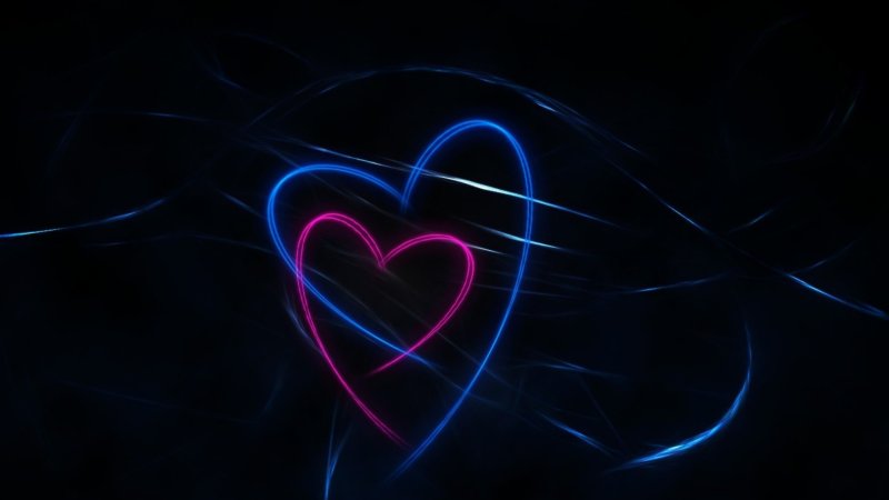 Неоновые сердечки на черном фоне