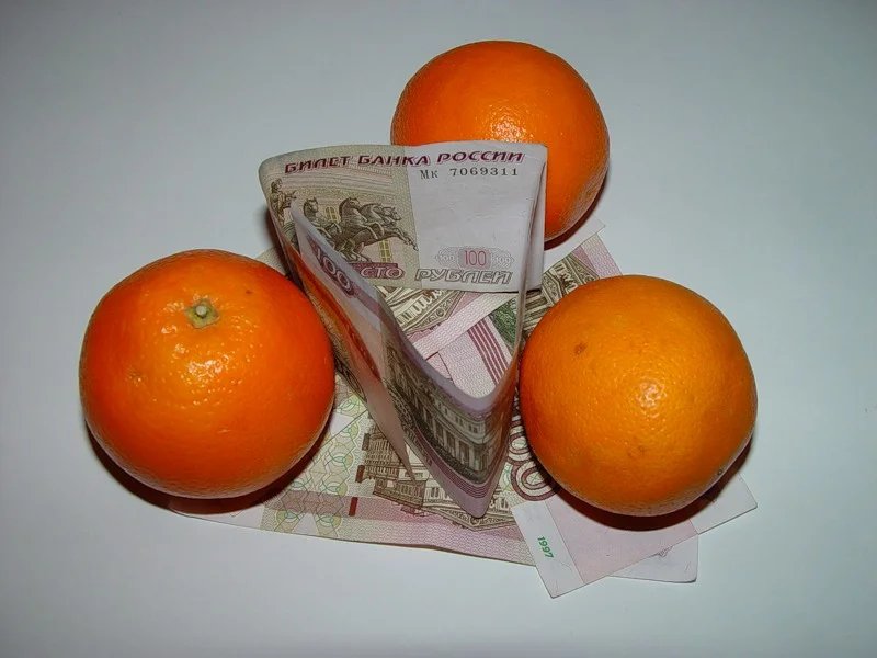 апельсины с деньгами